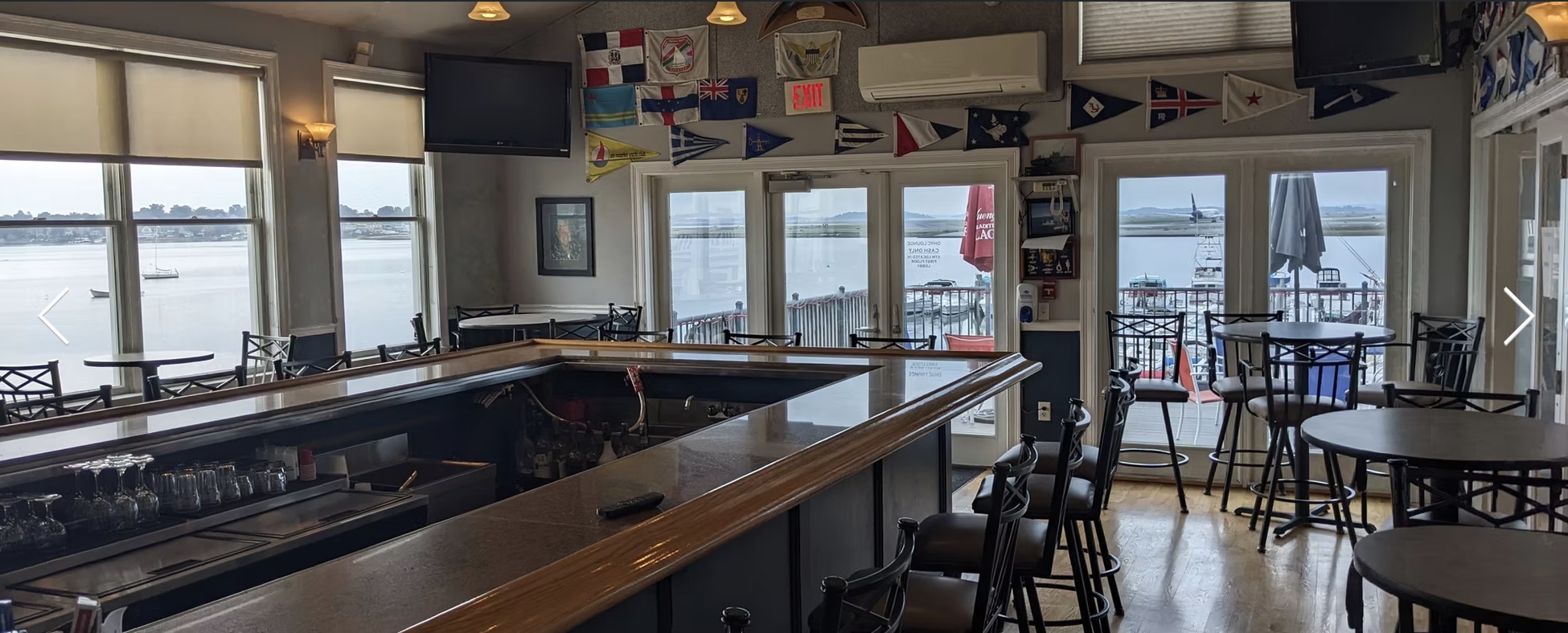 The members bar, hung with burgees from visiting clubs